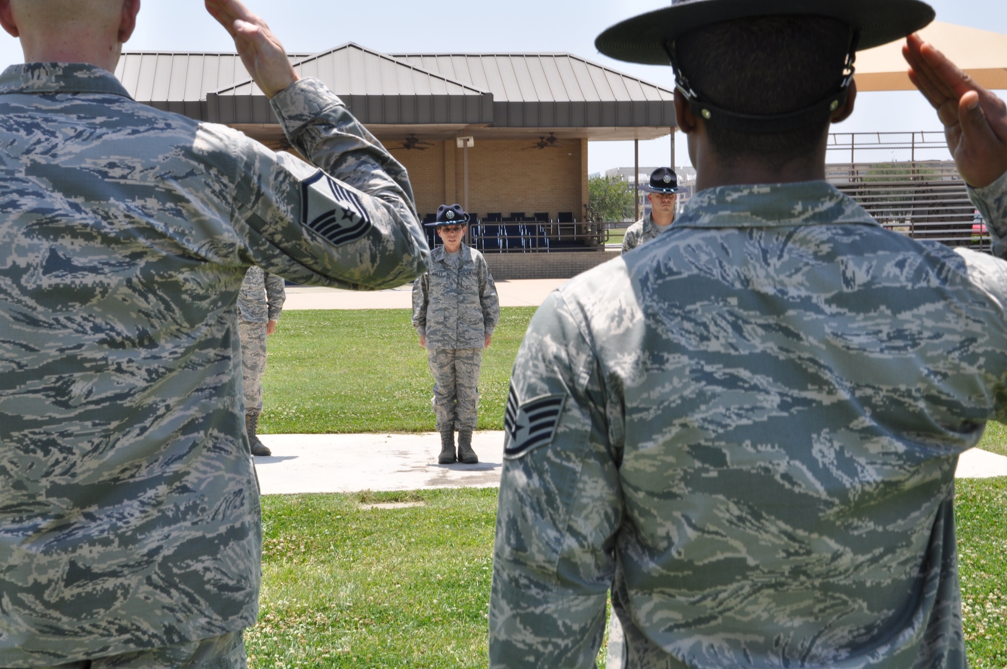Chief Master Sgt. Julie Begley, Superintendent, 326th Training Squadron, practices drill with her military training instructors, May 16. Begley retired following the graduation parade, May 17. She has been an MTI for 19 years of her 23 years of active duty and Reserve service.(Air Force photo by Master Sgt. Brannen Parrish)