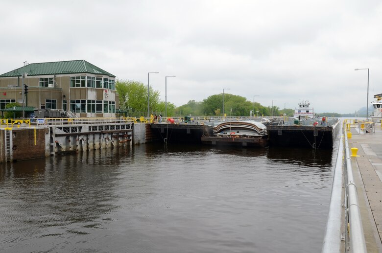 Ingram Barge Company's motor vessel R. Clayton McWhorter locks through Lock & Dam 5A near Winona, Minn., on May 17, 2013. This tow was the first tow to lock through following a barge struck and seriously damaged one of the upstream gates on May 16.