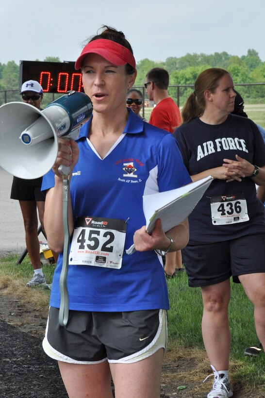Master Sgt. Wendi Conwell, first sergeant  for the 73rd Airlift Squadron, gives instructions to runners prior to the third annual 932nd AW First Sergeant fun run.  The event also helps raise funds for unit morale and welfare activities. Dozens of reservists ran in the event that was held on May 18, 2013.  (U.S. Air Force photo/Staff Sgt.  Amber Hodges).  
