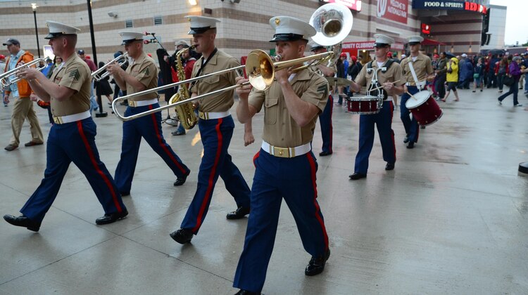 The Quantico Marine Band plays a tune as they walk down to the field during a  Nationals baseball game for Marine Corps Day at Nationals Park on May 8, 2013. The National League game between the Washington Nationals and the Detroit Tigers drew a crowd of more than 34,000, who paid respect to the sacrifices Marines – past and present – have made.