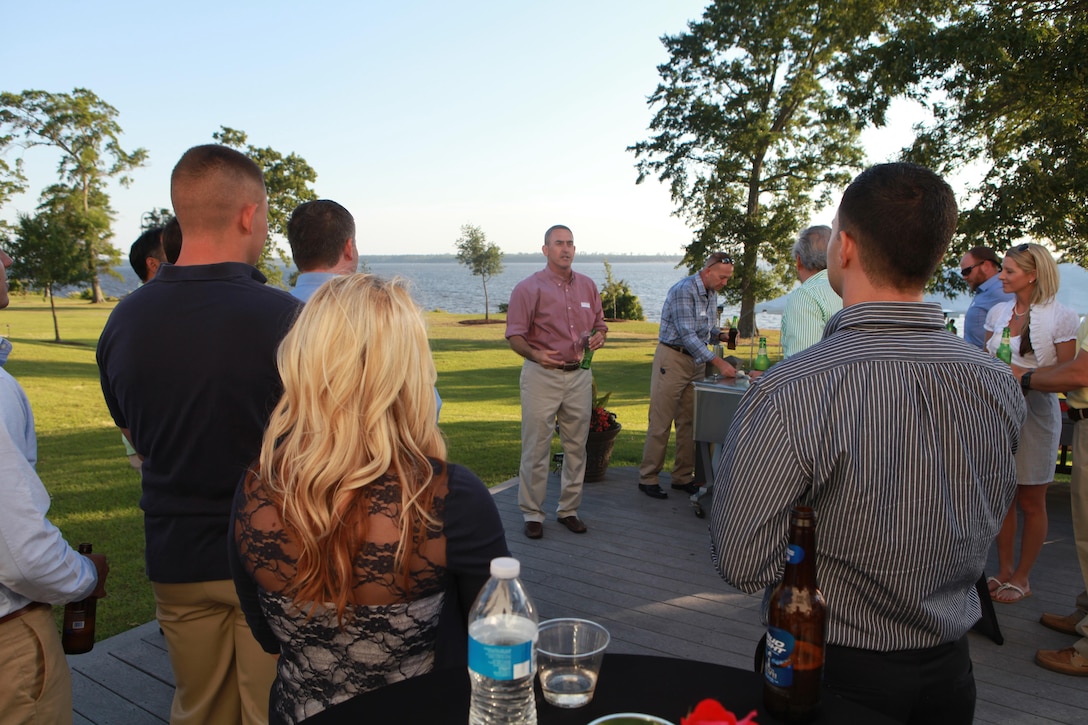 Brigadier Gen. James W. Lukeman, the commanding general for 2nd Marine Division, talks to the Marines and sailors attending the Dinner for Heroes at his house May15, 2013, and thanks them for attending. Leadership from all over 2nd Marine Division attended the dinner to honor the 17 Marines and sailors that had been recognized by their units as going above and beyond both in combat and in the United States. Mr. Paul Chapa, the founder of the Dinner for Heroes, started the event in January 2011 as a way to give back to Marines and sailors for their outstanding service. Other organizations such as Harris Teeter, Acosta and Nash Finch have joined with Chapa to donate food for the dinner.