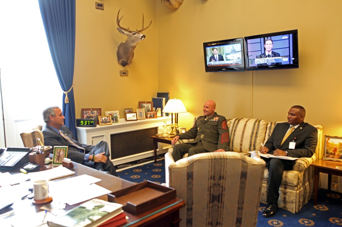 Sgt. Maj. Micheal P. Barrett, the 17th Sergeant Major of the Marine Corps, speaks to Rep. Jeff Miller of Florida on May 16, 2013, in Washington, D.C. (U.S. Marine Corps photo by Sgt. Marionne T. Mangrum)