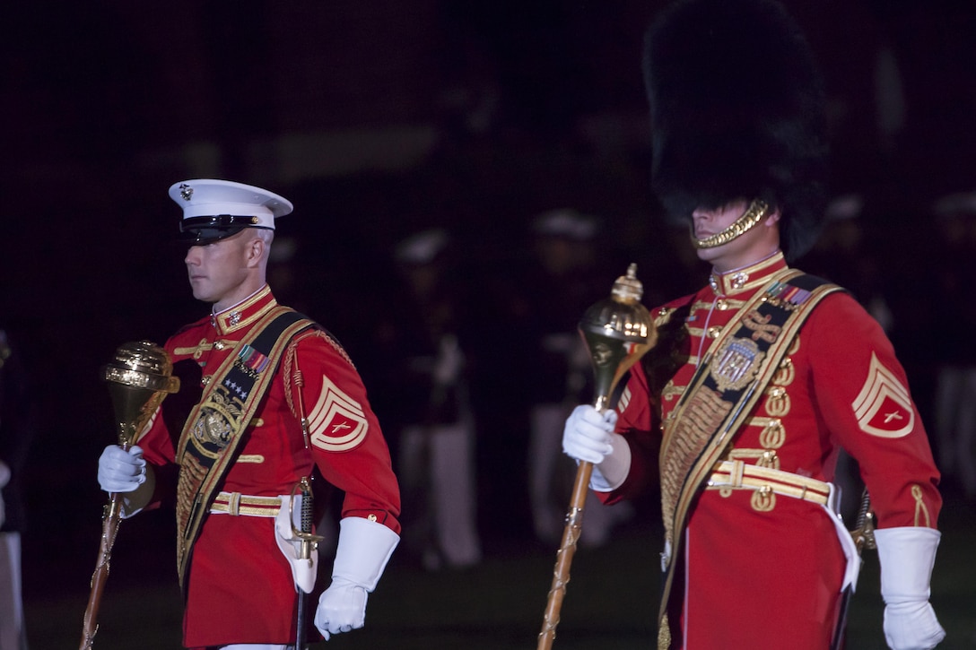 Gunnery Sgt. Keith Martinez, U.S. Marine Drum & Bugle Corps assitant drum major and Staff Sgt. Steven F. Williams, U.S. Marine Band assistant drum major, march side-to-side during a Friday Evening Parade at Marine Barracks Washington, D.C., May 17. 