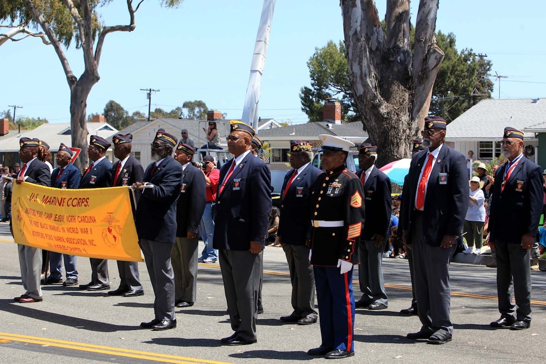 Montford Point Marines receive a standing ovation as they are honored for their sacrifices made in helping to pave the way for minorities in the armed forces at the 54th Annual Armed Forces Day Celebration and Parade at Torrance, Calif., May 18. The Montford Point Marines were the first African-Americans to enlist in the Marine Corps.