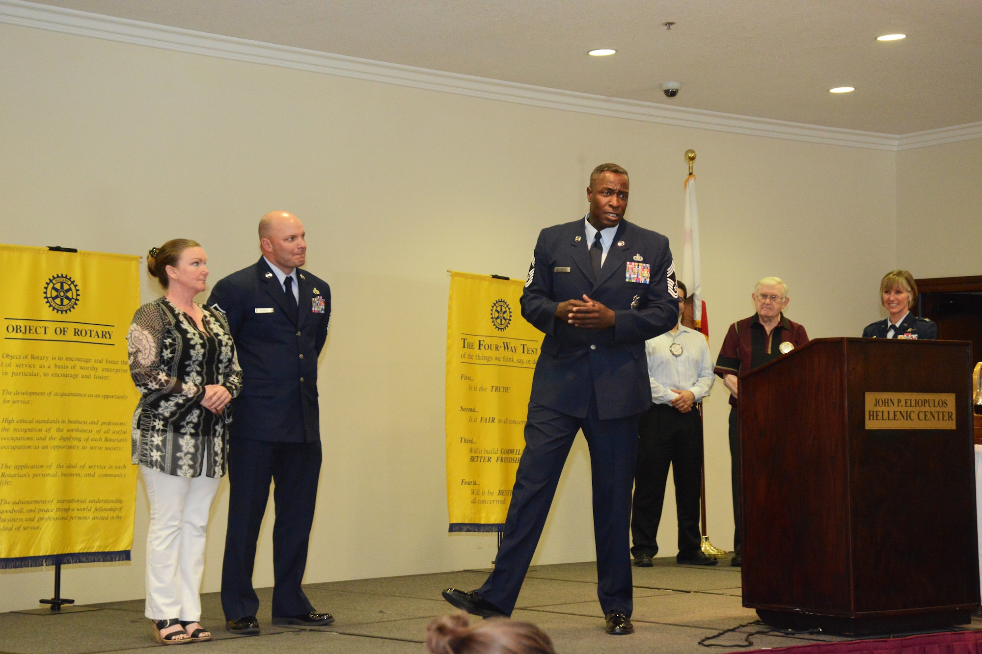 Chief Master Sgt. Darrell Shelton, 412th Security Forces Squadron, introduces Master Sgt. William Russell who was selected as the 412th Test Wing's First Sergeant of the Year. Active duty 412th TW annual awardees along with supervisors and family were invited to the Hellenic Center in Lancaster, Calif., to be honored by the Rotary Club of Lancaster West.  (U.S. Air Force photo by Kenji Thuloweit) 
 
 
