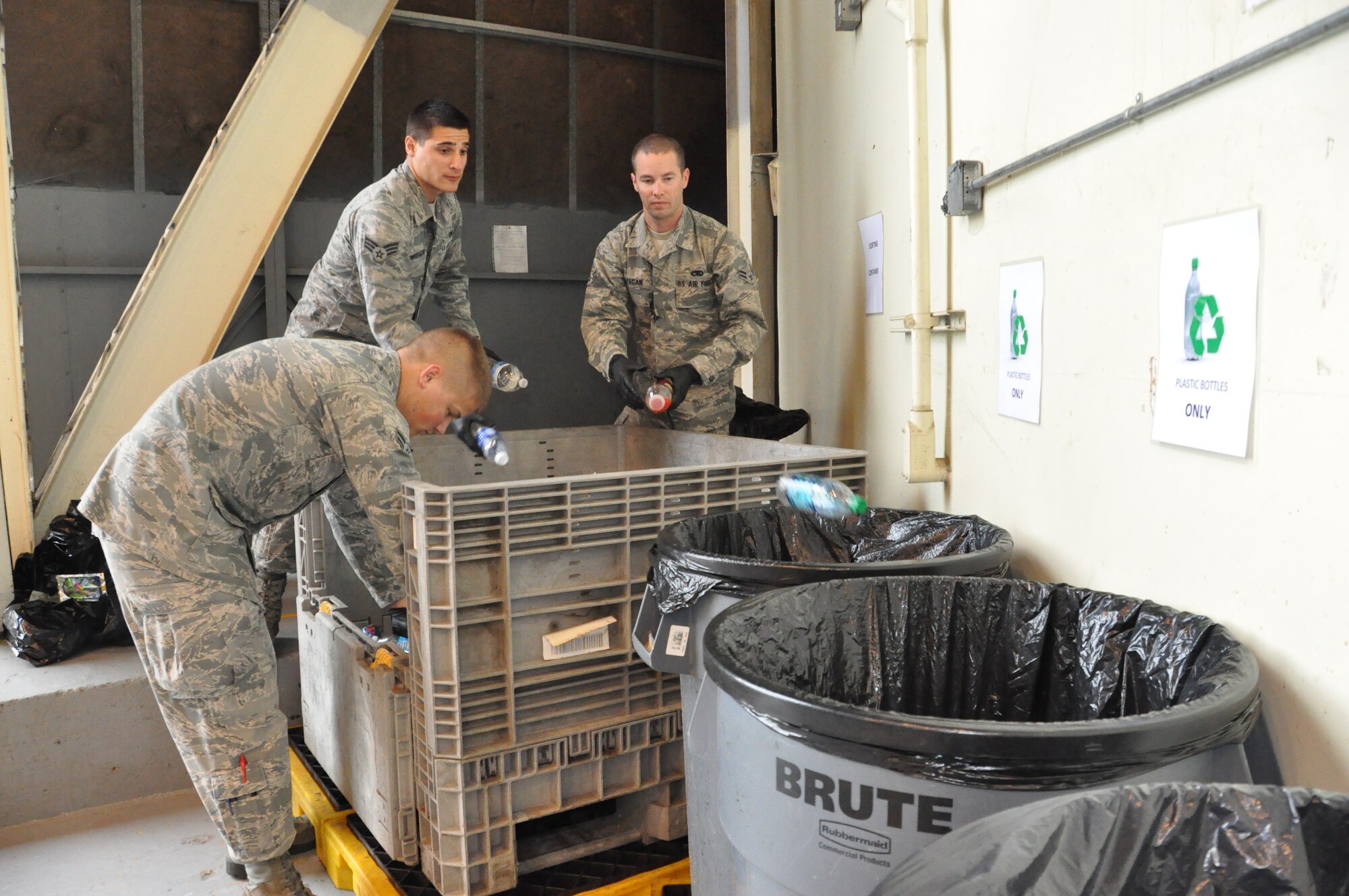 (left to right) Airman 1st Class Ben Winters, Senior Airman Cesar Mardirossian and Airman 1st Class David Fagan, continue the 60th Aircraft Maintenance Squadron’s recycling efforts after their team, the Dumpster Diver’s, won the base-wide recycling competition. The Dumpster Divers recycled more than 5,700 pounds of reusable products and raised more than $3,300 which goes toward their booster club to help fund squadron morale events and activities. (U.S. Air Force photo/Senior Airman Bryan Swink)
