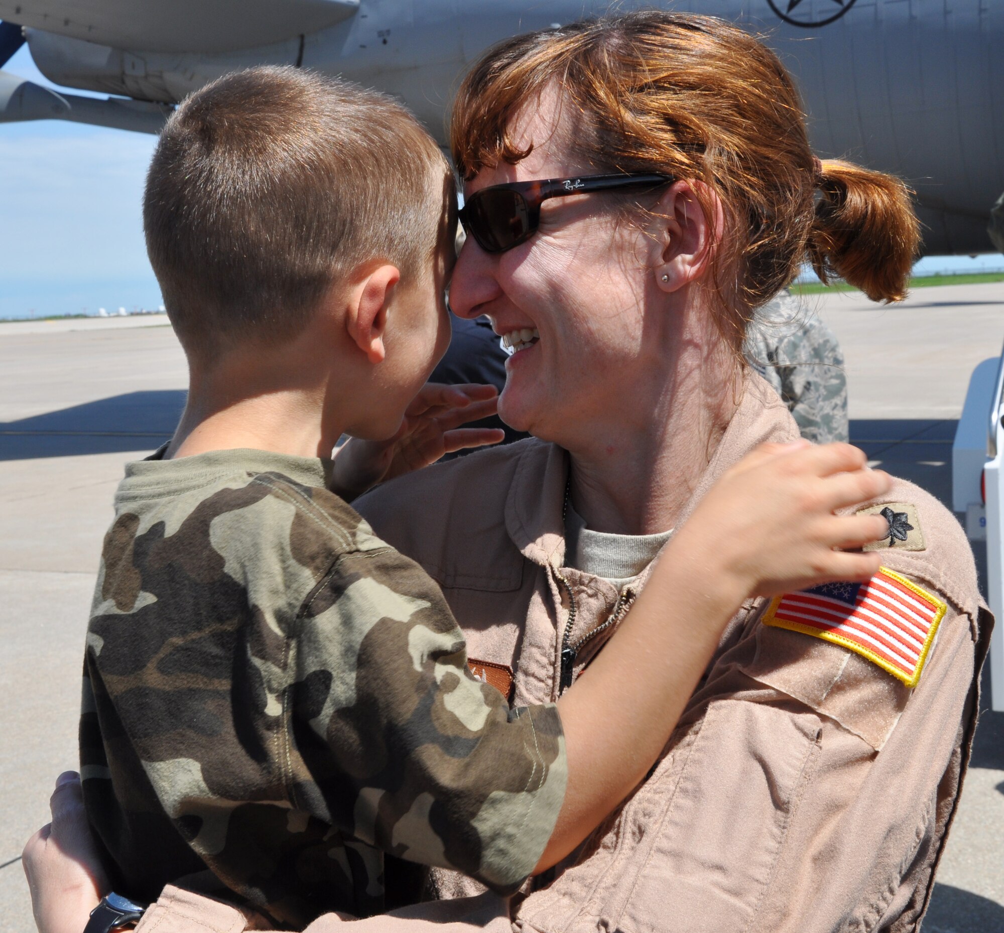 Lt. Col. Leah Schmidt, a pilot assigned to the 18th Air Refueling Squadron, 931st Air Refueling Group, greets her son on the flightline at McConnell Air Force Base, Kan., May 20, 1013.  Schmidt had just returned from a deployment to Southwest Asia, where she flew refueling missions in support of ongoing U.S. operations overseas.  (U.S. Air Force photo by Capt. Zach Anderson)