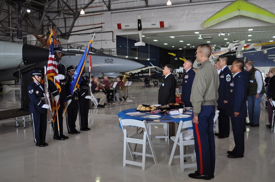 Members of the Air Reserve Personnel Center honor guard, Staff Sgt. Cindy Rodriguez, Senior Airman Sean Cooper, Staff Sgt. Ashley Kidder, and Staff Sgt. Letitia Edwards post the colors while the Smoky Hill Brass plays the national anthem during opening ceremonies. The Rotary Club of Denver Southeast sponsored the 7th Annual Veterans' Appreciation Breakfast at the Wings Over the Rockies Air and Space Museum in Denver, May 11. (Courtesy photo of Cyndee Johnson) 

