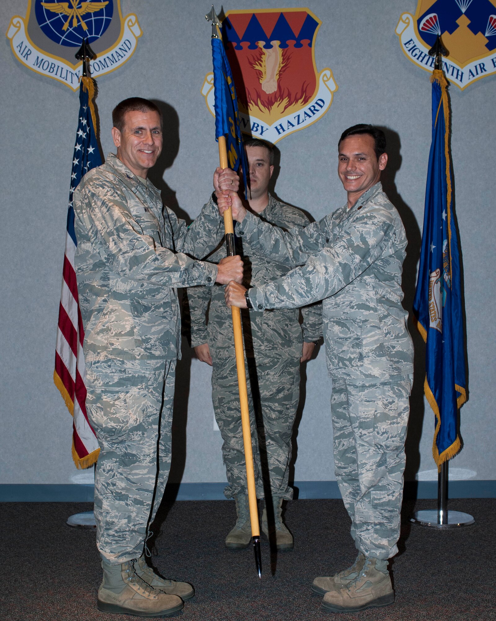 U.S. Air Force Col. Walter H. Ward, 317th Airlift Group commander, accepts the 317th Maintenance Operations Squadron (MOS) guidon from Maj. Christopher Fontana, 317th MOS commander, during a deactivation ceremony May 16, 2013, at Dyess Air Force Base, Texas. MOSs Air Force-wide are scheduled to be inactivated by the end of the fiscal year in an effort to better align field and company grade officer positions with operational requirements. The 317th MOS was active from April 1, 1997 to May 16, 2013. While the 317th MOS is being deactivated, its functions will continue as a designated flight, aligned under the 317th Maintenance Squadron. (U.S. Air Force photo by Airman 1st Class Kylsee Wisseman/Released)