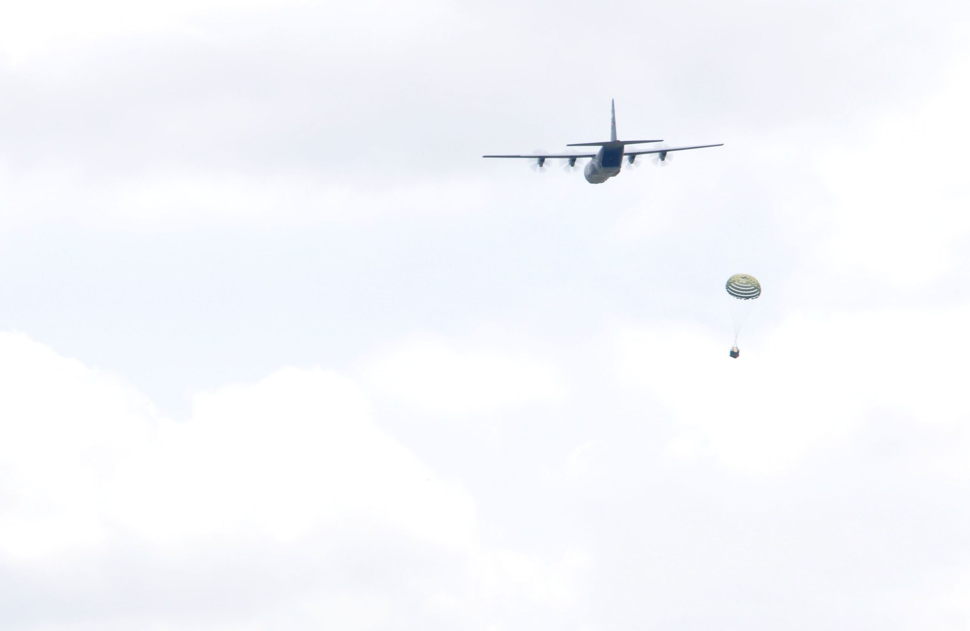 A Keesler C-130J from the 815th Airlift Squadron performs a training airdrop during Joint Safety Day May 18, 2013 at Stennis International Airport in Kiln, Miss. A product of the Mid-Air Collision Avoidance program, the event was open to all area pilots to increase dialogue between the military and civilian aviation communities. (U.S. Air Force photo by Airman 1st Class Stephan Coleman)