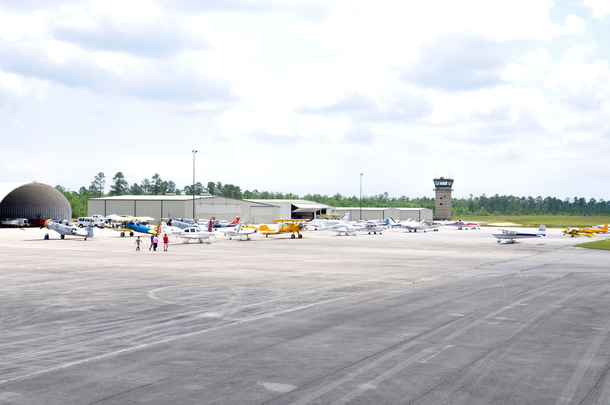 General aviation aircraft are lined up at Stennis International Airport during Keesler’s Joint Safety Day May 18, 2013 in Kiln, Miss. A product of the Mid-Air Collision Avoidance program, the event was open to all area pilots to increase dialogue between the military and civilian aviation communities. (U.S. Air Force photo by Airman 1st Class Stephan Coleman)