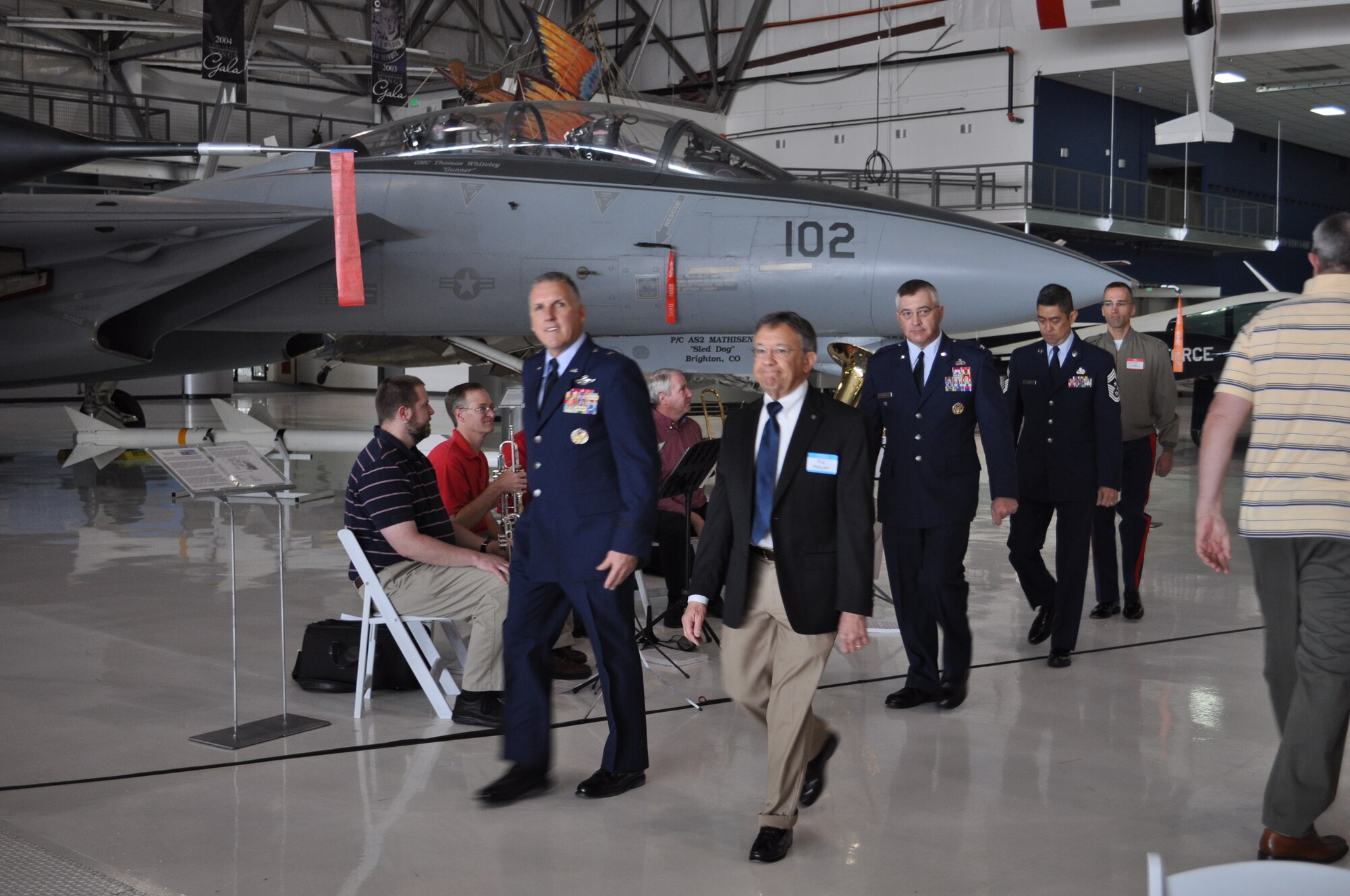 Brig. Gen. Jay Flournoy, commander of the Air Reserve Personnel Center, is escorted by Edward Meyer, president of the Rotary Club of Denver Southeast, followed by Col. Kenneth Klein, ARPC vice commander; Chief Master Sgt. Brian C. L. Wong, ARPC command chief; and Marine Corps Capt. Gary Sampson, commanding officer of Company A, Marine Cryptologic Support Battalion. The Rotary Club of Denver Southeast sponsored the 7th Annual Veterans' Appreciation Breakfast at the Wings Over the Rockies Museum in Denver, May 11. (Courtesy photo of Cyndee Johnson)