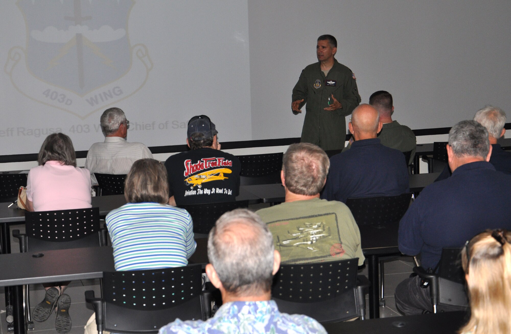 Lt. Col. Jeff Ragusa, 403rd Wing chief of safety, briefs civilian pilots on C-130J flight patterns and behaviors in the Keesler airspace during Joint Safety Day May 18, 2013 at Stennis International Airport in Kiln, Miss. A product of the Mid-Air Collision Avoidance program, the event was open to all area pilots to increase dialogue between the military and civilian aviation communities. (U.S. Air Force photo by Airman 1st Class Stephan Coleman)
