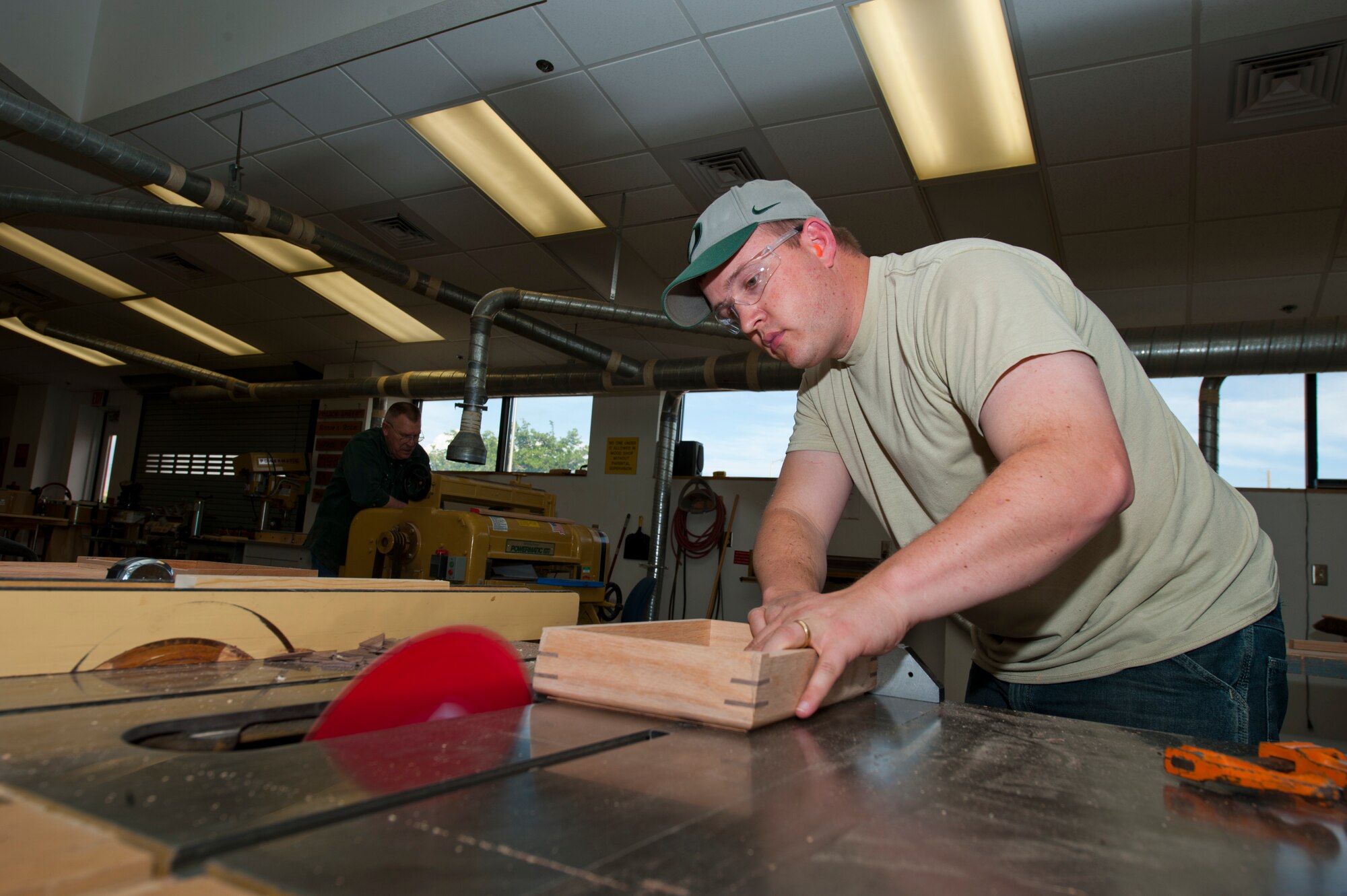 Major Zeb Krantz, 6th Reconnaissance Squadron assistant director of operations, uses a saw to bevel a piece of wood inside the Arts and Crafts Center at Holloman Air Force Base, N.M., May 14. The wood shop is newly reopened at Holloman AFB and offers a safety class that allows Airmen to utilize all of the wood shop equipment for personal projects.