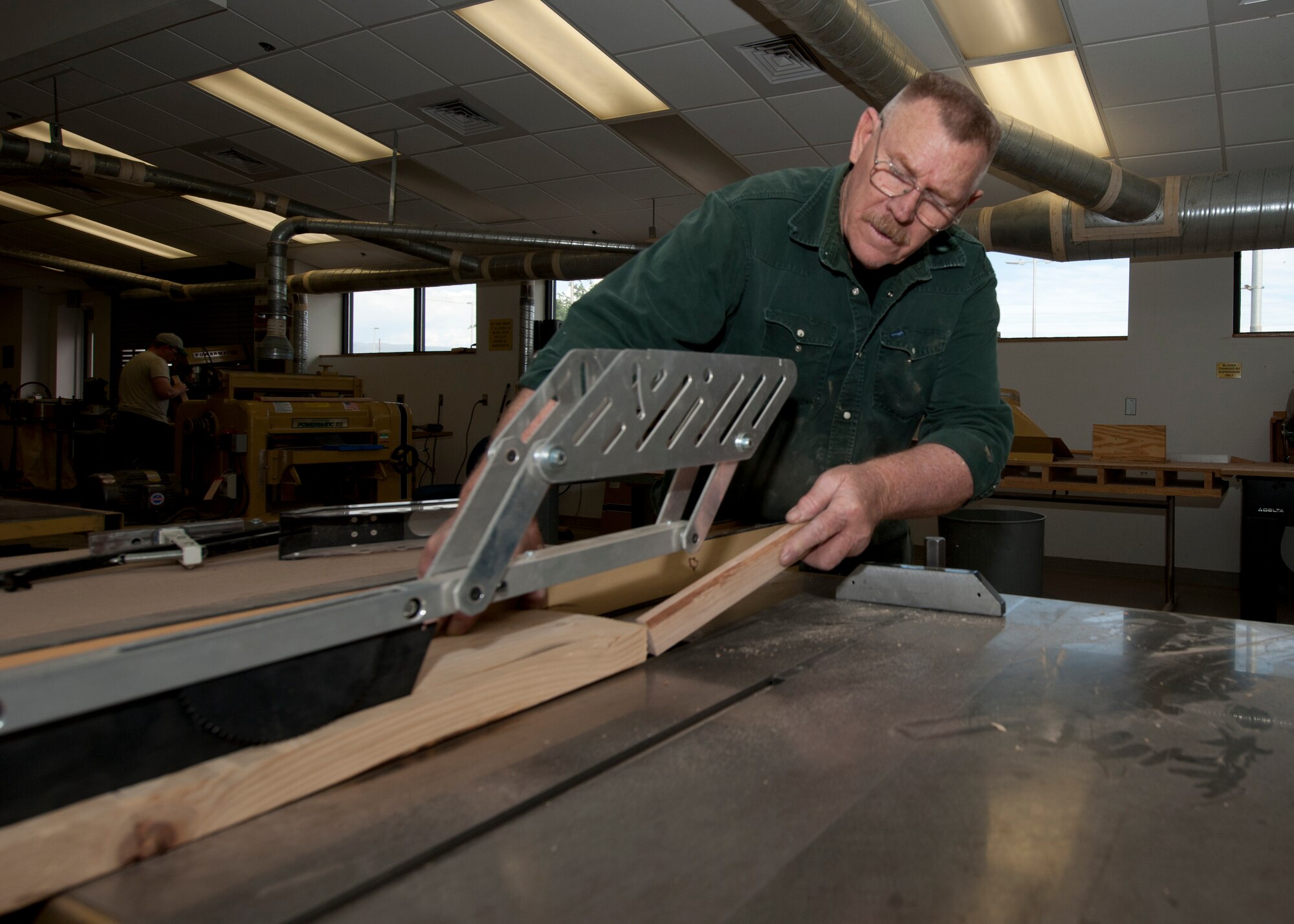 Joe Brinegar, 49th Force Support Squadron wood shop supervisor, uses a saw to cut a piece of wood inside the Arts and Crafts Center at Holloman Air Force Base, N.M., May 14. The wood shop offers Airmen the opportunity to utilize top-of-the-line wood working equipment to complete personal projects or satisfy hobbies. The wood shop is open Tuesdays, Thursdays and Saturdays from 4 p.m. to 7 p.m.