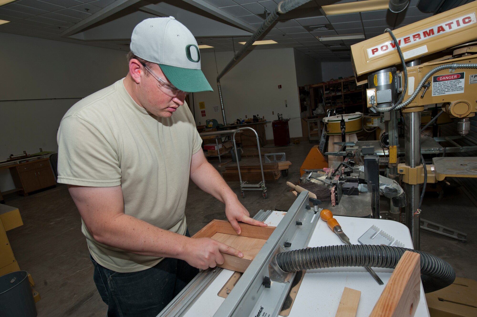 Major Zeb Krantz, 6th Reconnaissance Squadron assistant director of operations, uses a carving machine to add detail to a project inside the Arts and Crafts Center at Holloman Air Force Base, N.M., May 14. The wood shop is newly reopened at Holloman AFB and offers a safety class that allows Airmen to utilize all of the wood shop equipment for personal projects.