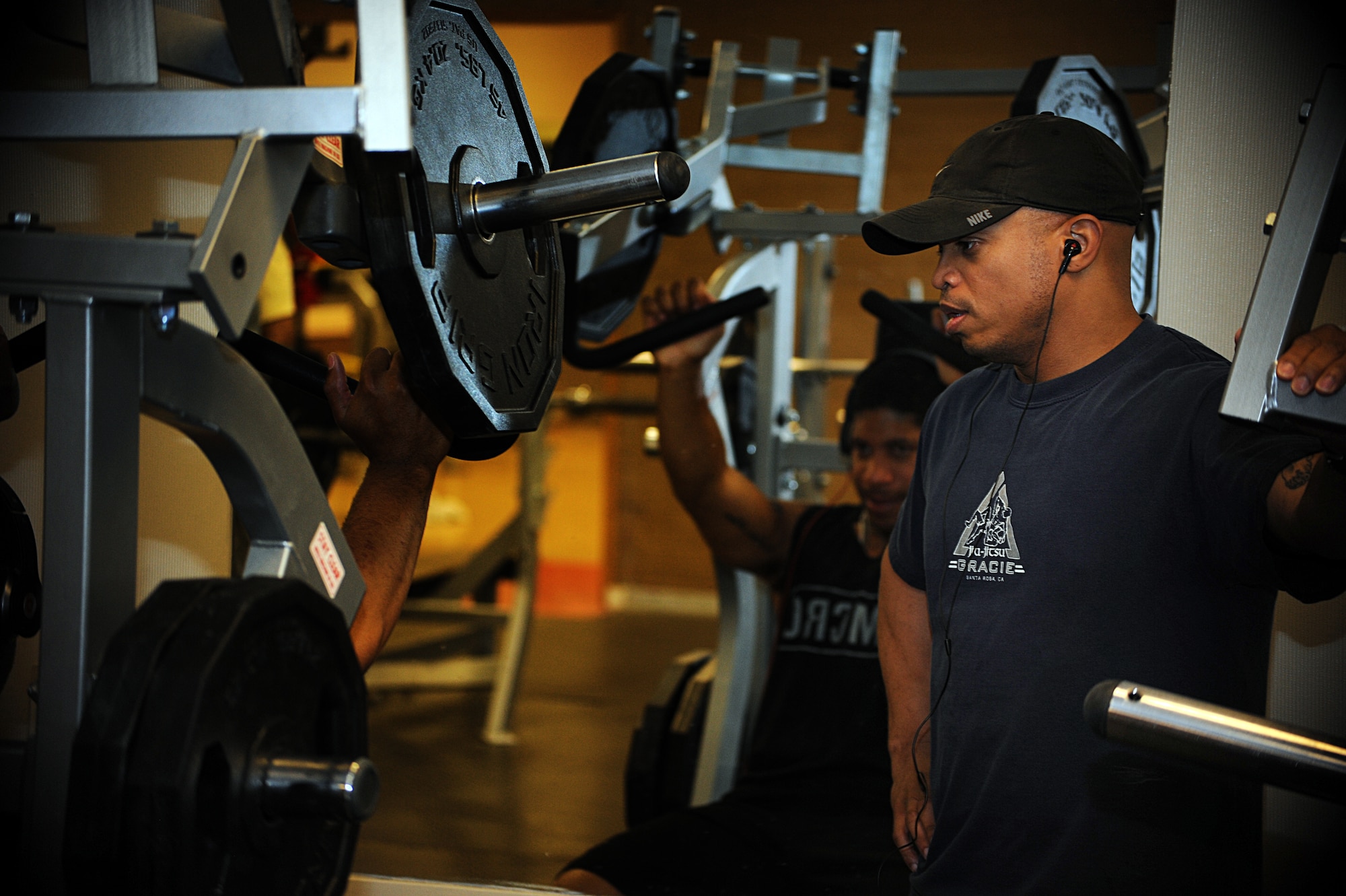U.S. Air Force Master Sgt. Claude Lawson, 27th Special Operations Force Support Squadron military personnel flight superintendent, coaches an athlete at Cannon Air Force Base, N.M., May 18, 2013.  Certified as a personal trainer, Lawson uses his Mixed Martial Arts background to coach new fighters.  (U.S. Air Force photo/Senior Airman Jette Carr)