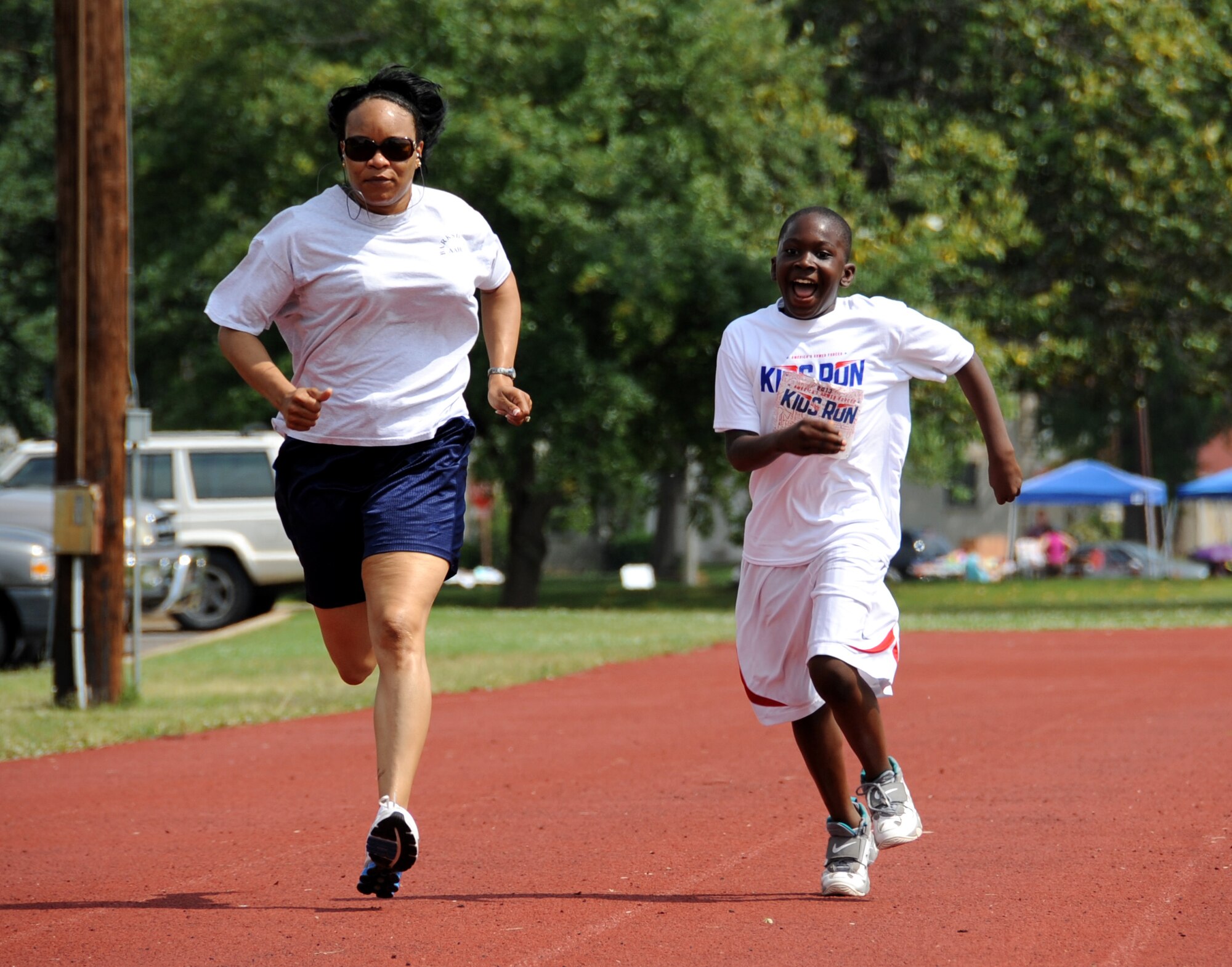 Members of Team Barksdale approach the finish line during the two-mile Kids Run on Barksdale Air Force Base, La., May 18, 2013. The Kids Run was held in conjunction with Armed Forces Day, which celebrates the unification of all military organizations under the Department of Defense. (U.S. Air Force photo/Airman 1st Class Benjamin Gonsier)