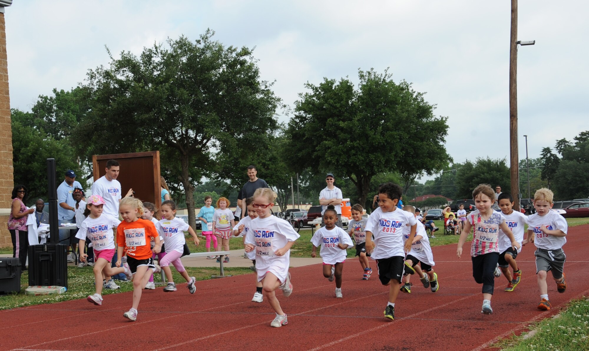 Barksdale children take off during a half-mile Kids Run on Barksdale Air Force Base, La., May 18, 2013. The Kids Run was held in conjunction with Armed Forces Day, which celebrates the unification of all military organizations under the Department of Defense. (U.S. Air Force photo/Airman 1st Class Benjamin Gonsier) 
