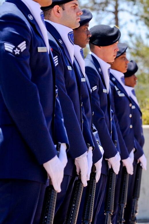 VANDENBERG AIR FORCE BASE, Calif. – Members of the 30th Security Forces Squadron honor guard stand at parade rest during a closing ceremony here Friday, May 17, 2013. National Police Week commemorated law enforcement personnel who have fallen in the line of duty. (U.S. Air Force photo/Airman Yvonne Morales)