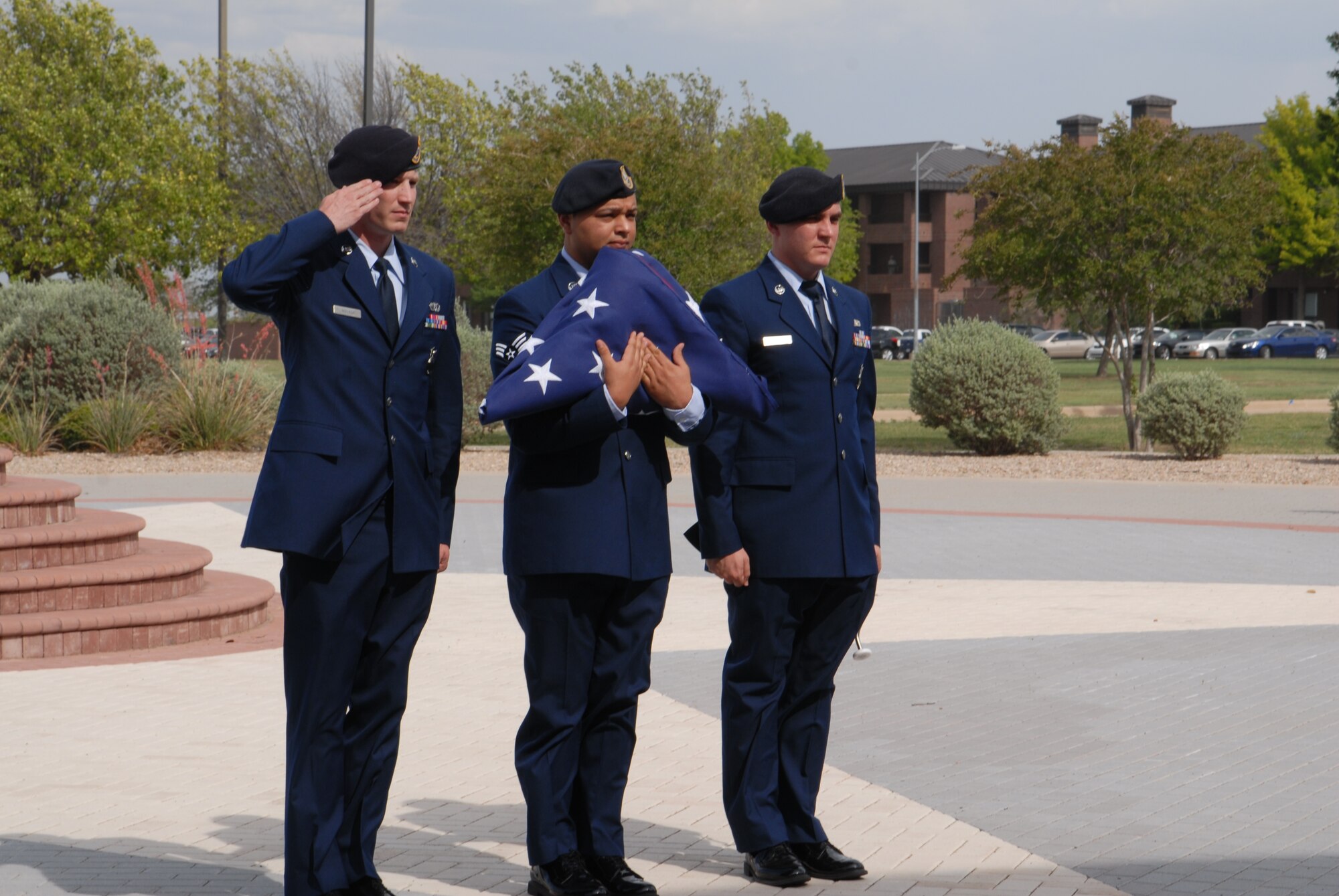 GOODFELLOW AIR FORCE BASE, Texas – Service members from the 17th Security Forces Squadron retire the colors during the retreat ceremony at the Norma Brown building, May 17. Security Forces held different events and activities to commemorate Peace Officers Memorial Day and Police week from May 13 to 17. (U.S. Air Force photo/ Airman 1st Class Breonna Fields)  

