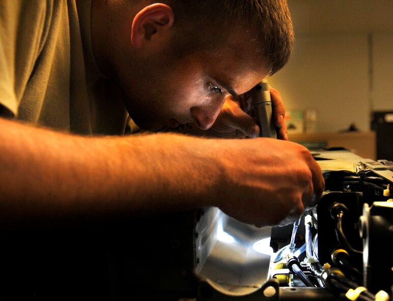 Senior Airman Garron Theriault, 455th Expeditionary Maintenance Squadron egress technician, uses a mirror to examine the interior of an A-10 Thunderbolt II aircraft seat for cracks during an inspection on Bagram Airfield, Afghanistan, May 17, 2013. Aircrew egress system technicians ensure the safety of 74th Expeditionary Fighter Squadron pilots by inspecting and performing preventative maintenance on the egress systems and components of the A-10. A-10s from Bagram fly daily to provide close air support to forces operating in Afghanistan. Theriault is from Harrison, Maine. ( U.S. Air Force photo/ Staff Sgt/ Stephenie Wade) 