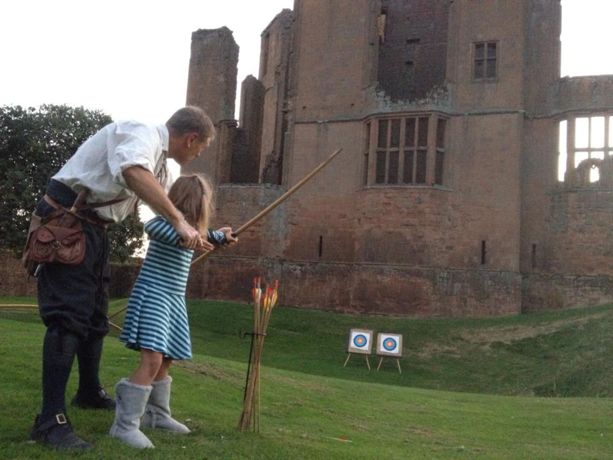 Above, the Kenilworth Castle Sleepover boasted archery lessons on the green as well as an exclusive evening tour of the grounds, ghost stories and an overnight stay in the preserved gate house. The building in front of the archery targets was built entirely for the purpose of housing Queen Elizabeth I and her entourage when she visited Robert Dudley, the Earl of Leicester and rumored beau of the virgin queen.  (Courtesy photo by Stacia Zachary/Released)
