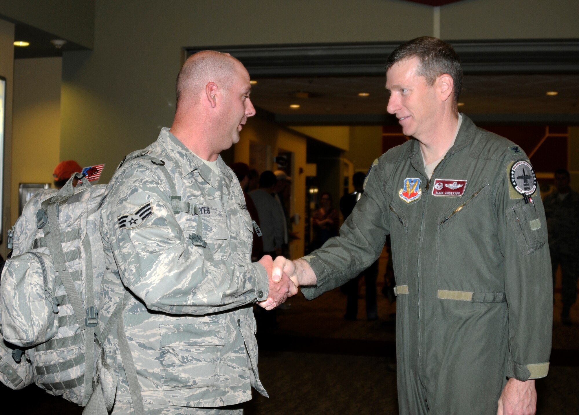 Senior Airman James Hayes, a force protection specialist with the 188th Fighter Wing’s Security Forces Squadron, shakes 188th commander, Col. Mark Anderson’s hand before he boards his flight. Hayes departed Fort Smith for a six-month deployment to Southwest Asia in support of Operation Enduring Freedom, May 12, 2013. While there, the 188th SFS will provide installation support and security for assigned aircraft. (U.S. Air National Guard photo by Senior Airman Hannah Landeros/188th Fighter Wing Public Affairs)