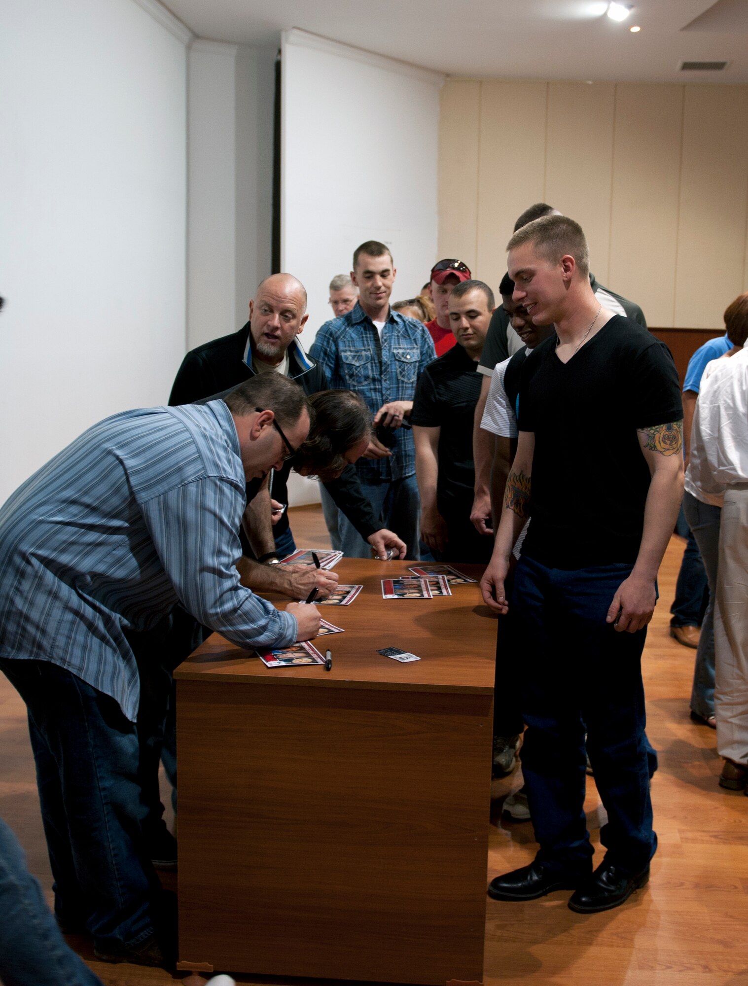 Comedians from Don Barnhart’s All-Star Comedy team sign autographs for U.S. Army soldiers during a meet and greet session at the end of their performance, May 19, 2013, at Gaziantep, Turkey. The soldiers are from the 3rd Battalion, 2nd Air Defense Artillery Regiment out of Fort Sill, Okla. They are deployed to Gaziantep as part of the NATO mission to ensure security at the Turkish-Syrian border. (U.S. Air Force photo by Senior Airman Daniel Phelps/Released)