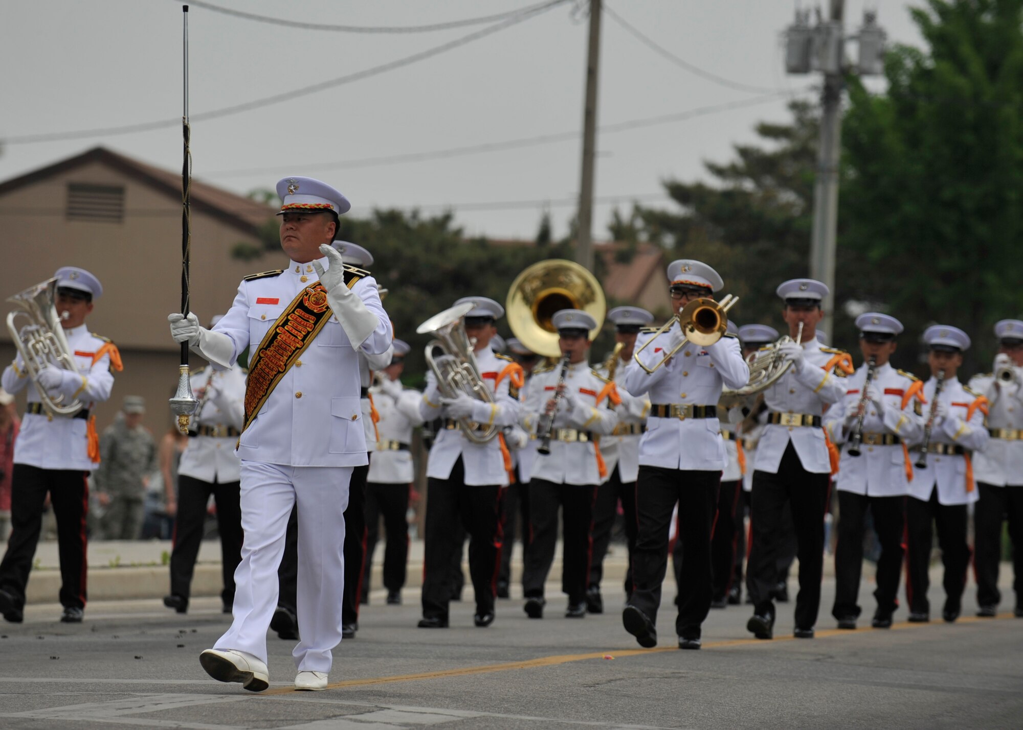 Members of the Republic of Korea Marine Corps Band march in the Veterans of Foreign Wars Armed Forces Day Parade at Osan Air Base, Republic of Korea, May 18, 2013. The ROK Marines were one of more than 35 different organizations that participated in the parade that honors American service members who have served their country in times of war and peace. (U.S. Air Force photo/Senior Airman Siuta B. Ika)