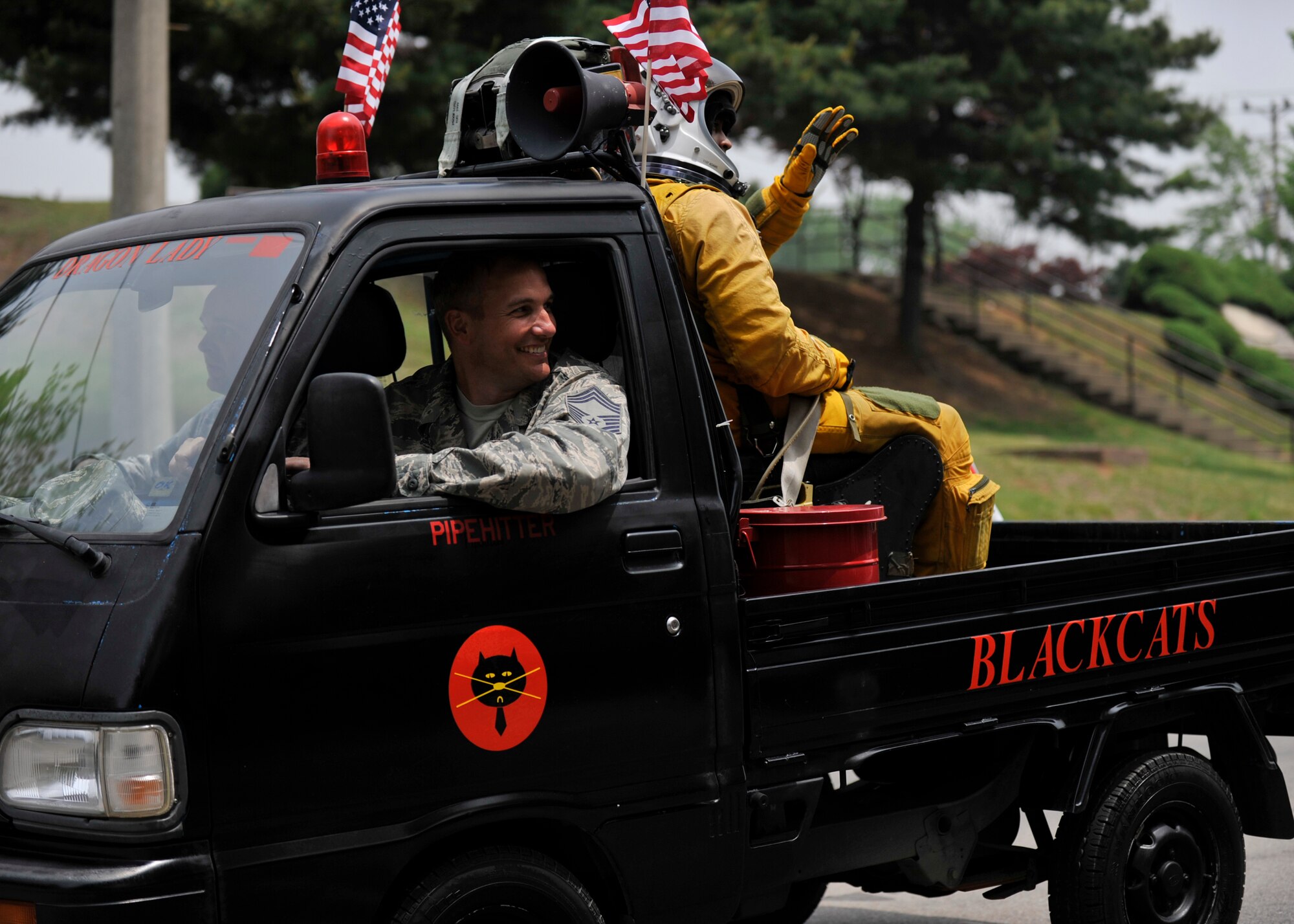 Members of the 5th Reconnaissance Squadron ride in the Veterans of Foreign Wars Armed Forces Day Parade at Osan Air Base, Republic of Korea, May 18, 2013. The “Black Cats” were one of more than 35 different organizations that participated in the parade that honors American service members who have served their country in times of war and peace. (U.S. Air Force photo/Senior Airman Siuta B. Ika)