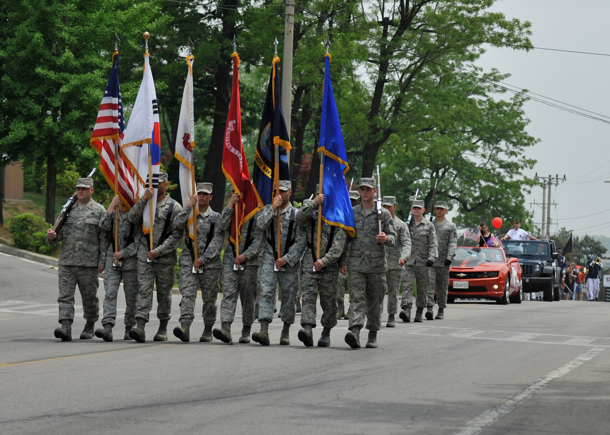 Members of the Osan Honor Guard march in the Veterans of Foreign Wars Armed Forces Day Parade at Osan Air Base, Republic of Korea, May 18, 2013. The honor guardsmen led the parade route, which started at the Osan Main Gate on Songtan Boulevard and ended by the Turumi Lodge. (U.S. Air Force photo/Senior Airman Siuta B. Ika)