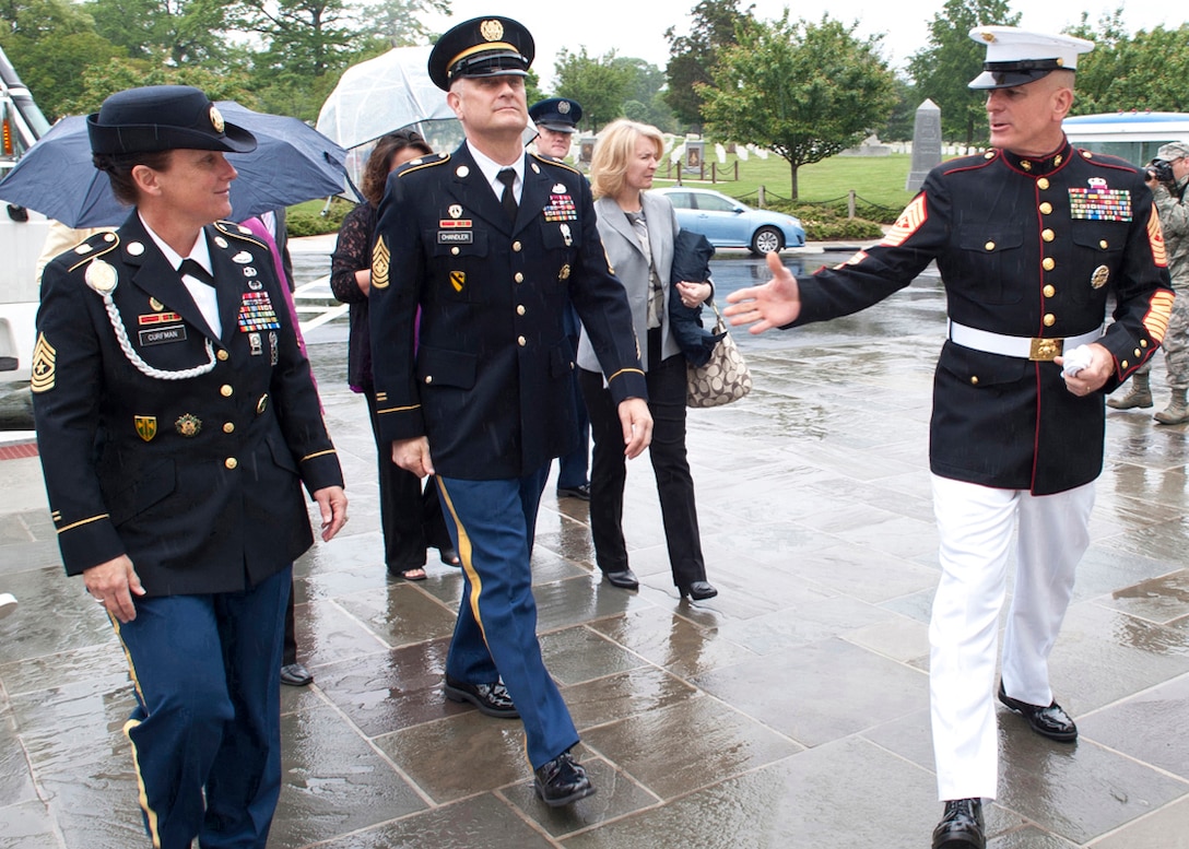 Marine Corps Sgt. Maj. Bryan B. Battaglia, senior enlisted advisor to the chairman of the Joint Chiefs of Staff, Sgt. Maj. of the Army Raymond F. Chandler III and Army Sgt. Maj. Brenda Curfman arrive for a wreath-laying ceremony to mark Armed Forces Day at the Tomb of the Unknowns in Arlington National Cemetery, Va., May 18, 2013. Senior enlisted advisors from each service branch attended the inaugural wreath-laying ceremony.
