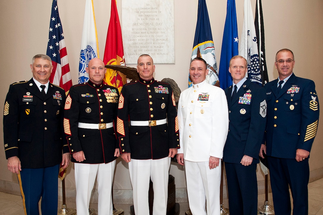 From left: Sgt. Maj. of the Army Robert F. Chandler III, Sgt. Maj. of the Marine Corp Micheal P. Barrett,  Sgt. Maj. Bryan B. Battaglia, senior enlisted advisor to the chairman of the Joint Chiefs of Staff , Master Chief Petty Officer of the Navy Mike D. Stevens, Chief Master Sgt. of the Air Force James A. Cody and Master Chief Petty Officer of the Coast Guard Michael P. Leavitt stop for a group photo after the wreath-laying ceremony in Arlington National Cemetery, Va., May 18, 2013. 