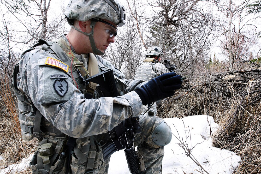 Army Spc. William Hayes checks his compass during small team training at Biathlon Training Area on Joint Base Elmendorf-Richardson, Alaska, May 14, 2013. Hayes is ssigned to Company A, 1st Battalion, Airborne, 501st Infantry Regiment.