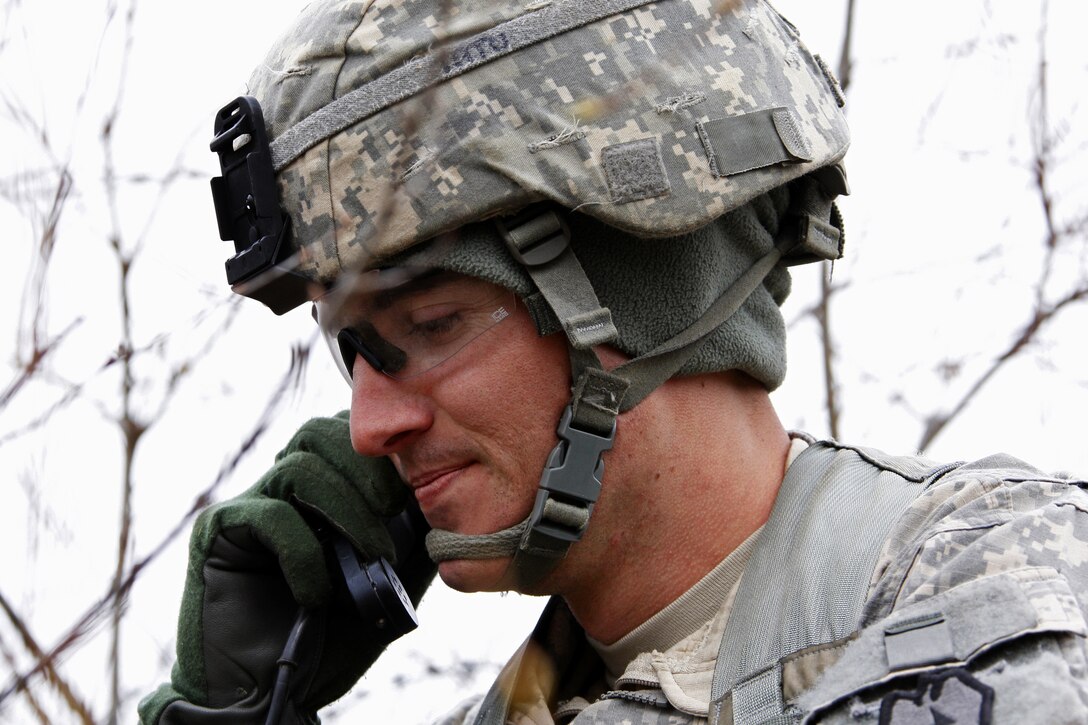 Army Spc. Colin Tatu communicates with a convoy as the unit conducts breaching operations at Training Area 412 on Joint Base Elmendorf-Richardson, Alaska, May 14, 2013. Tatu is ssigned to Company D, 3rd Battalion, Airborne, 509th Infantry Regiment.