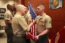Sgt. Eric P. Mcintosh, the motor transportation chief with the 9th Marine Corps District, is presented a Certificate of Commendation by Col. Robert Gates, chief of staff at Marine Corps Recruit Depot, Western Recruiting Region, at an awards ceremony ending the Western Recruiting Region Noncomissioned Officer of the Quarter board, May 9. Mcintosh was selected as the WRR NCO of the quarter.