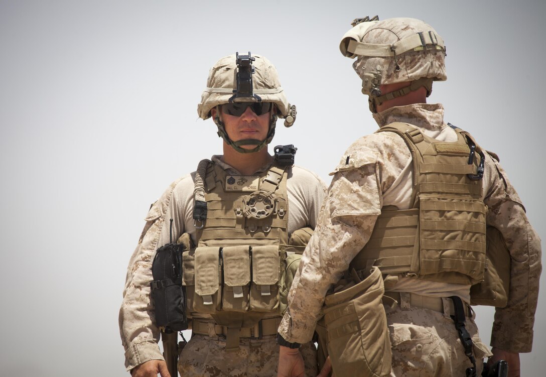 U.S. Marine Corps Staff Sgt. Caleb Hall, left, with Mobile Strike Force Advisor Team observes as the Afghan National Army (ANA) Mobile Strike Force Kandak conduct a live-fire exercise near Camp Shorabak, Helmand province, Afghanistan, May 20, 2013. The Marines with the Mobile Strike Force Advisor Team instructed and mentored their ANA counterparts on how to properly utilize their weapons systems. (U.S. Marine Corps photo by Staff Sgt. Ezekiel R. Kitandwe/Released)