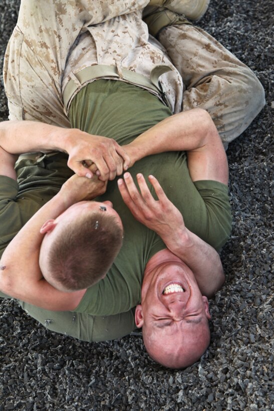 Pfcs. Dylan Murphy and Nicholas Reis, infantrymen, Company C, 1st Battalion, 7th Marine Regiment, spar during a Marine Corps Martial Arts Program session. The Marines practiced their grappling and their striking maneuvers. 
