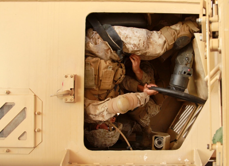 Marines and sailors with Headquarters and Service Company, 3rd Battalion, 7th Marine Regiment, conduct egress training at the Combat Center’s Battle Simulation Center to better prepare them for a Mine Resistant Ambush Protected Vehicle rollover April 25. 