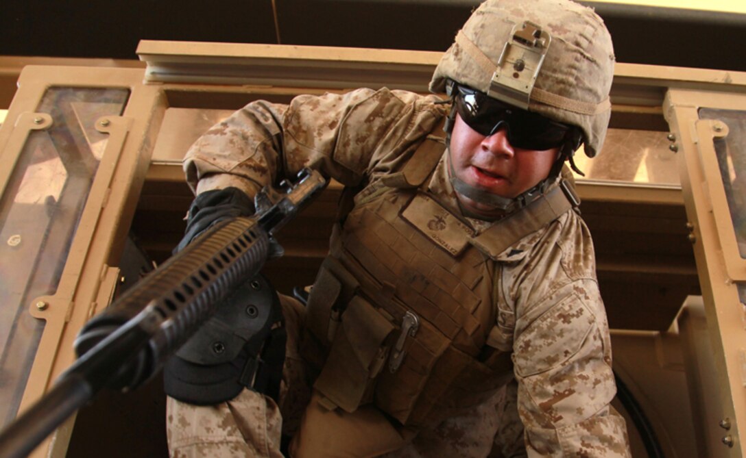 Marines and sailors with Headquarters and Service Company, 3rd Battalion, 7th Marine Regiment conducts egress training at the Combat Center’s Battle Simulation Center to better prepare them for a Mine Resistant Ambush Protected Vehicle rollover April 25. 
