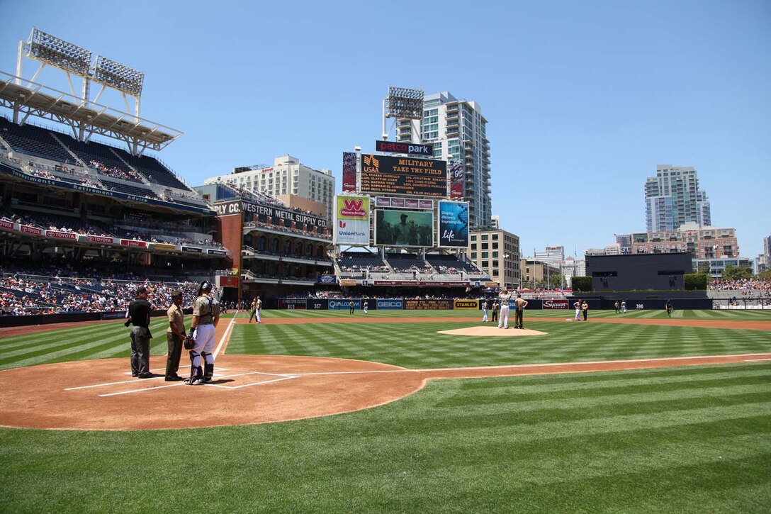 Marines with the 15th Marine Expeditionary Unit take positions on the field and meet members of the San Diego Padres during the team's Military Appreciation Day at PETCO Park in San Diego, May 19. The 15th MEU was invited to the game to celebrate their return from an eight-month deployment. During the event, Marines from each supporting element of the MEU stepped onto the field in front of thousands as the 15th MEU Command Element, Battalion Landing Team 3/5, Combat Logistics Battalion 15 and Marine Medium Helicopter Squadron 364 (Rein.) were recognized. (U.S. Marine Corps photo by Cpl. Timothy Childers/Released)