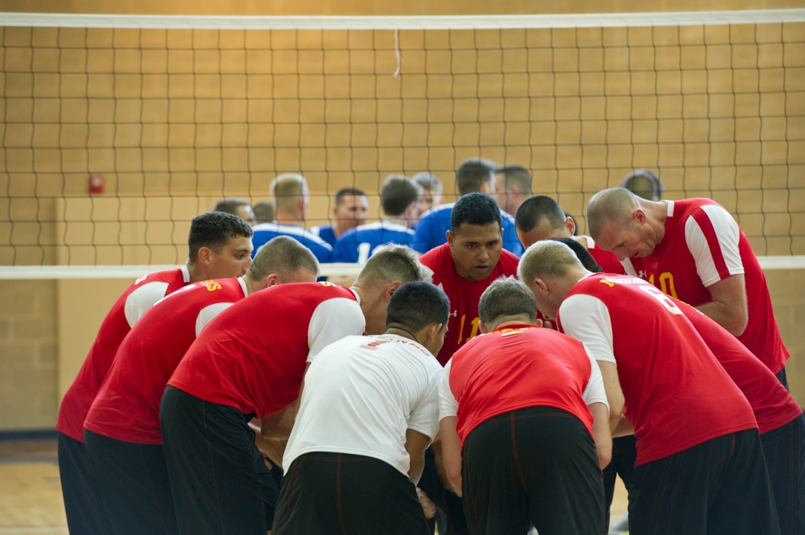 LCpl Seanoa Fuifatu (USMC #11 Camp LeJeune, NC) totally focused in the team's huddle against the Air Force on day one.  