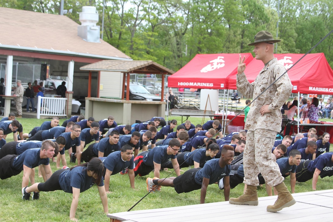 Sgt. Matthew Lenza, a Marine Corps drill instructor, spends quality physical training time with the poolees during Recruiting Station New Jersey's 2013 Sergeant Majors Cup Saturday, May 18th.