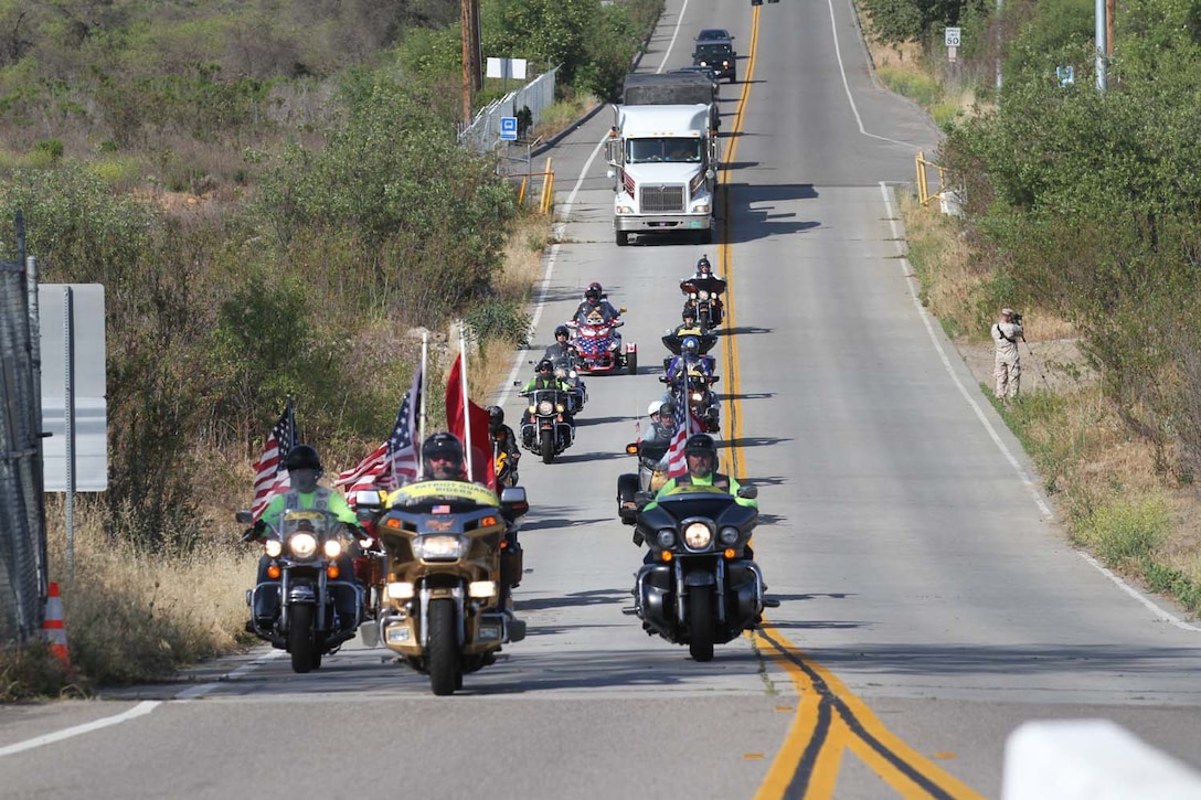 Patriot Guard Riders escort 5th Marine Regiment's Operation Enduring Freedom Memorial to the Camp San Mateo memorial garden here, May 20, 2013. The riders escorted the 7-ton Barre granite memorial from Barre, Vt., to Camp Pendleton during the course of 10 days.