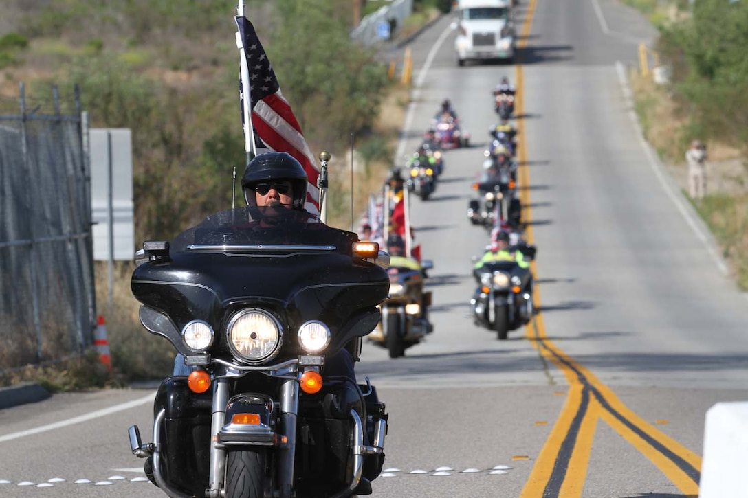 Patriot Guard Riders escort 5th Marine Regiment's Operation Enduring Freedom Memorial to the Camp San Mateo memorial garden here, May 20, 2013. The riders escorted the 7-ton Barre granite memorial from Barre, Vt., to Camp Pendleton during the course of 10 days.