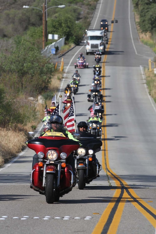Patriot Guard Riders escort 5th Marine Regiment's Operation Enduring Freedom Memorial to the Camp San Mateo memorial garden here, May 20, 2013. The riders escorted the 7-ton Barre granite memorial from Barre, Vt., to Camp Pendleton during the course of 10 days.