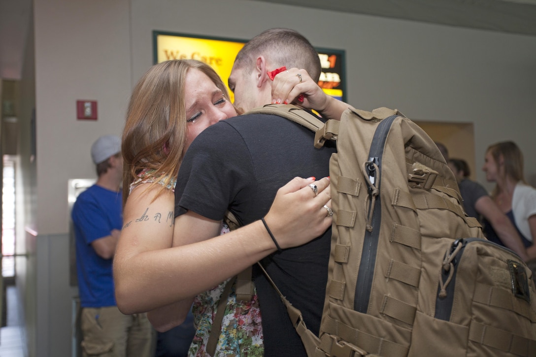 Lance Cpl. Dakota Johnson, a flight equipment technician with Marine Attack Squadron 513 aboard Marine Corps Air Station Yuma, Ariz., is welcomed home by his wife May 18, after a 6-month deployment with the 31st Marine Expeditionary Unit. This was also the first time Johnson ever met or held his 2-month-old son, who was born while he was deployed. The Marines from VMA-513, who returned home to MCAS Yuma, were operating in Japan and aboard the USS Bonhomme Richard in the North Pacific Ocean since December of last year.  This marks the final adventure for the VMA-513 Flying Nightmares, as the Squadron is slated for decommissioning this summer.