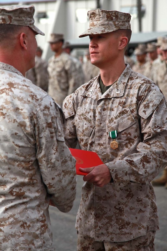 Captain Clayton L. Wiggins, disbursing officer, Command Element, 15th Marine Expeditionary Unit, is awarded the Navy and Marine Corps Commendation Medal at Camp Pendleton, Calif., May 15. Wiggins was awarded the medal for his service during the MEU's Western Pacific Deployment.  Wiggins, 34, is from Franklin, N.C. (U.S. Marine Corps photo by Cpl. Timothy Childers/Released)