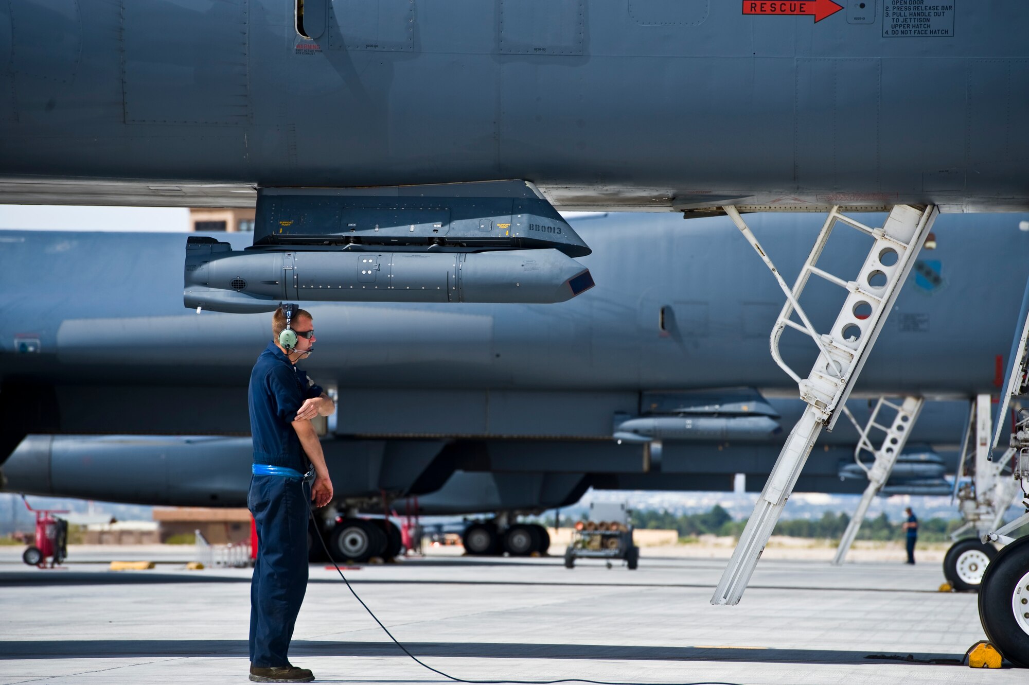 Senior Airman Matthew Parise, 7th Aircraft Maintenance Squadron crew chief from Dyess Air Force Base, Texas, conducts a pre-flight check during a Green Flag exercise May 21, 2013, at Nellis Air Force Base, Nev. Green Flag-West is a realistic air-land integration combat training exercise meant to replicate desert warfare conditions. (U.S. Air Force photo by Airman 1st Class Christopher Tam)